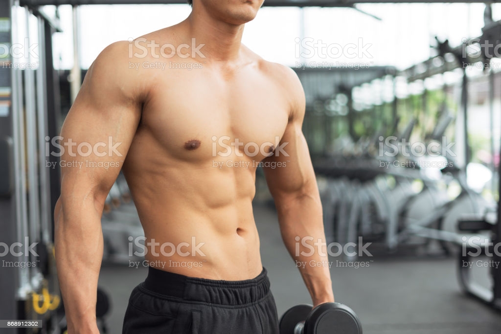 Fitness Man Showing Muscular Body In Gym Stock Photo - Download Image Now -  iStock